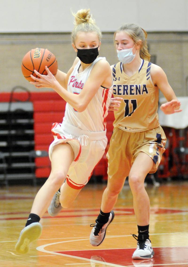 Ottawa's Grace Carroll dribbles past the defense of Serena's Paisley Twait Friday at Kingman Gym in Ottawa.