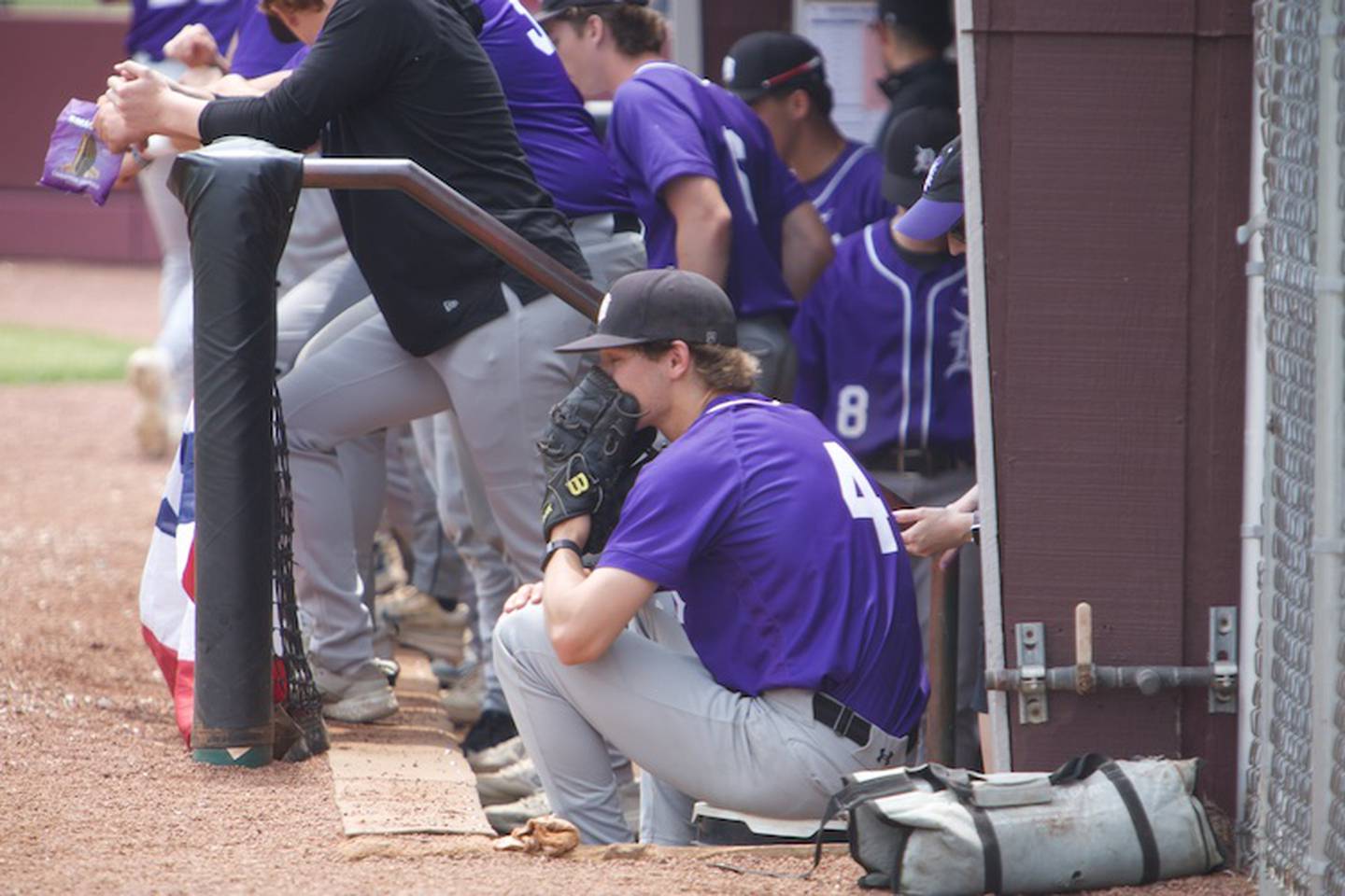 Downers Grove North's Nick Konopiots looks on through his mitt against Waubonsie at the Class 4A Sectional Final on Saturday, June 7, 2025 in Lockport.