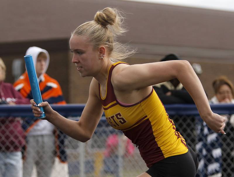 Richmond-Burton’s Emily Wisniewski starts the 4x200 meter run for her team during the IHSA Class 2A Johnsburg Girls Track and Field Sectional Meet on Wednesday, May 13, 2026, at Johnsburg High School.