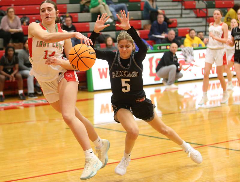 L-P's Drew Depenbrock saves the ball from going out of bounce as Kaneland's Sophia Rosati looks to steal it on Wednesday, Jan. 15, 2025 in Sellett Gymnasium at L-P High School.