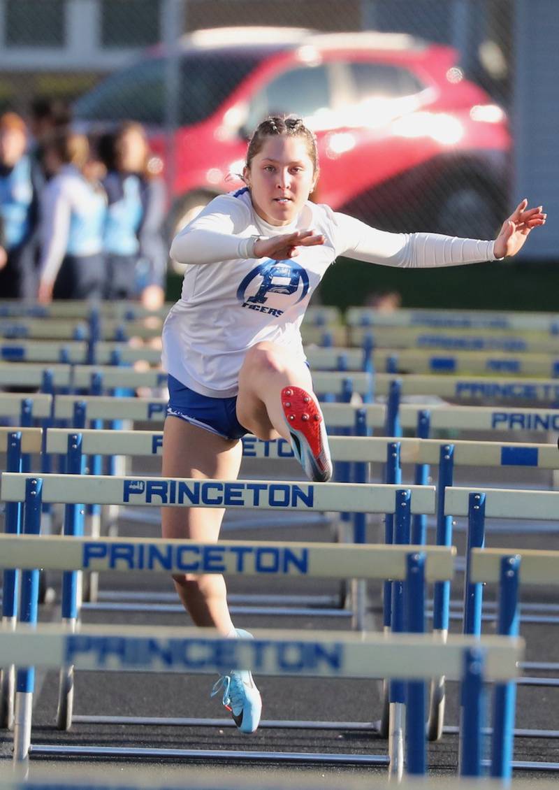 Princeton's Miyah Fox clears a hurdle in Thursday's Howard-Monier Girls Invitational at Princeton.