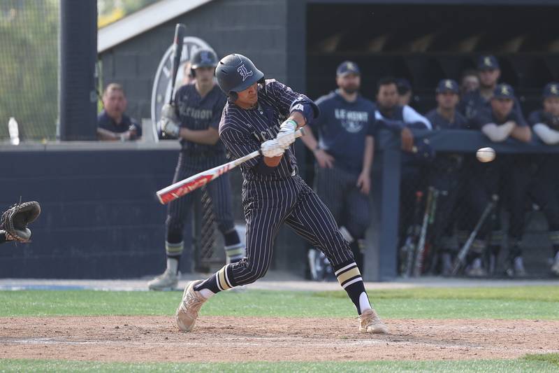 Lemont’s Noah Tomaras drives in two runs on an error against Hinsdale South on Wednesday, May 24, 2023, in Lemont.