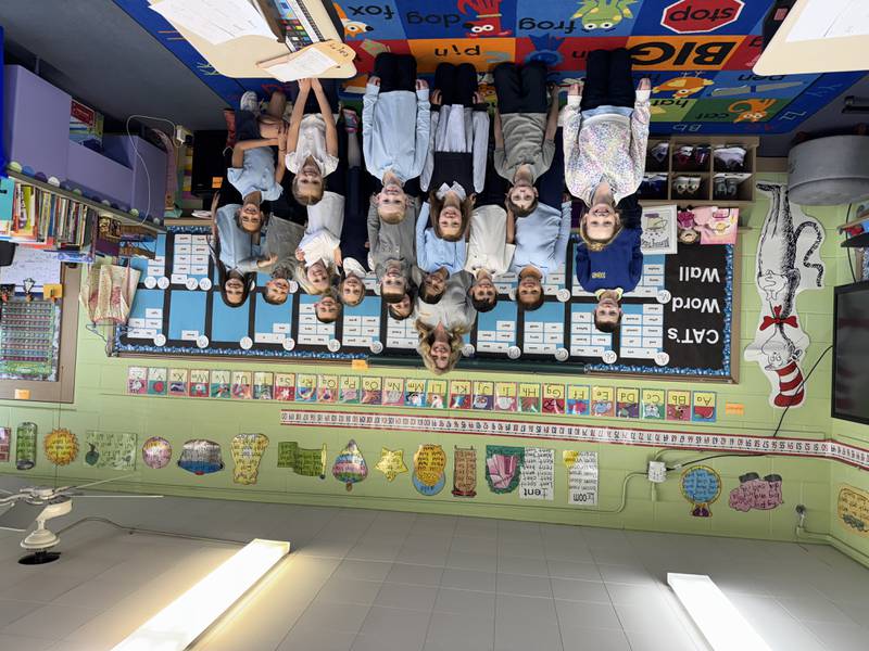 Kristen Hemmersbach with her first grade students at Immaculate Conception School on Thursday, March 20, 2025.