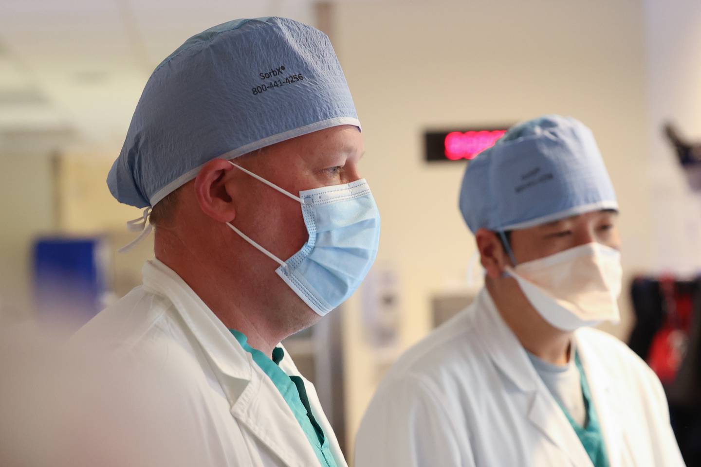 Dr. Christopher Bane, left, and Dr. Hong Jun Yun go over images of a patient with a technician at Silver Cross Hospital. Shockwave IVL is relatively new technology that uses shock waves to break up kidney stones and other calculuses while leaving soft tissue undisturbed. Monday, April 25, 2022, in New Lenox.