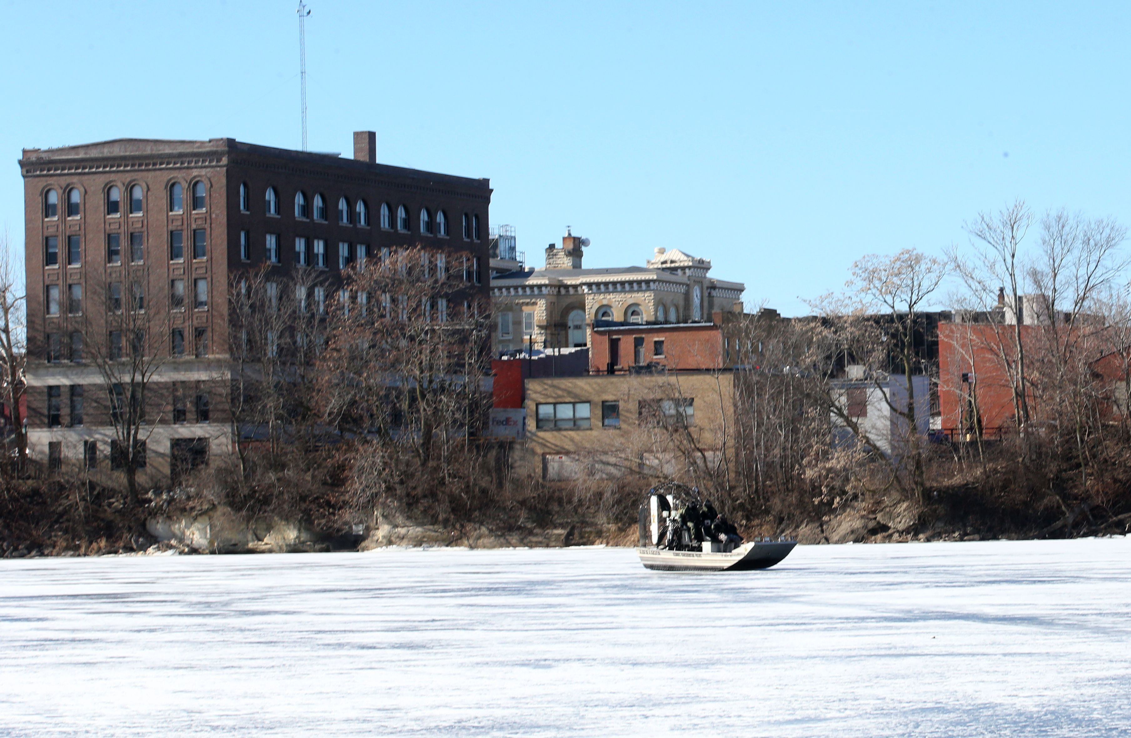 Illinois Department of Natural Resources Conservation Police officers use an airboat to glide on top of ice during a training mission along the Fox River on Monday, Jan. 27, 2025, in Ottawa.
