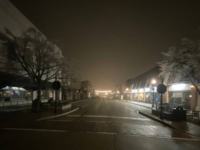 Downtown Crystal Lake – where downed power lines from an ice storm caused numerous outages – is partially lit about 5 a.m. Thursday, Feb. 23, 2023, in this photo submitted by Northwest Herald reader Zachary Elsner.