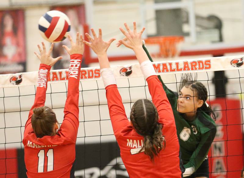 St. Bede's Kijah Lucas sneaks the ball past Henry-Senachwine defenders Alison Mitchell and teammte Harper Schrock on Tuesday, Oct. 21, 2025 at Henry-Senachwine High School.
