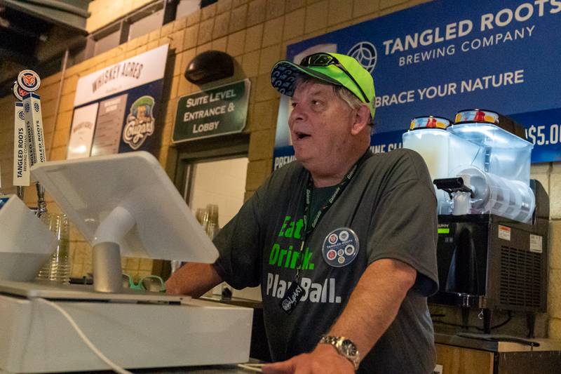 Sean King for the Daily Herald
Vendor Larry Watts of Geneva sells beer prior to the start of the Kane County Cougars game at Northwestern Medicine Field in Geneva on Friday, May 13, 2022.