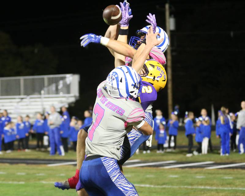 Princeton's Casey Etheridge (top) swats the ball away with the help from teammate Gavin Lanham (bottom) intended for Mendota's Keegan Beetz on Friday, Oct. 10, 2025 at Bryant Field in Princeton.