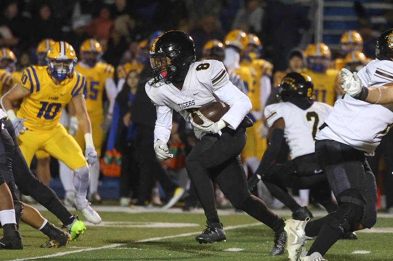 Joliet West’s Taivaughn Johnson rushes against Lyons Township in the first round of the playoffs on Friday, Nov. 1, 2024 in La Grange.