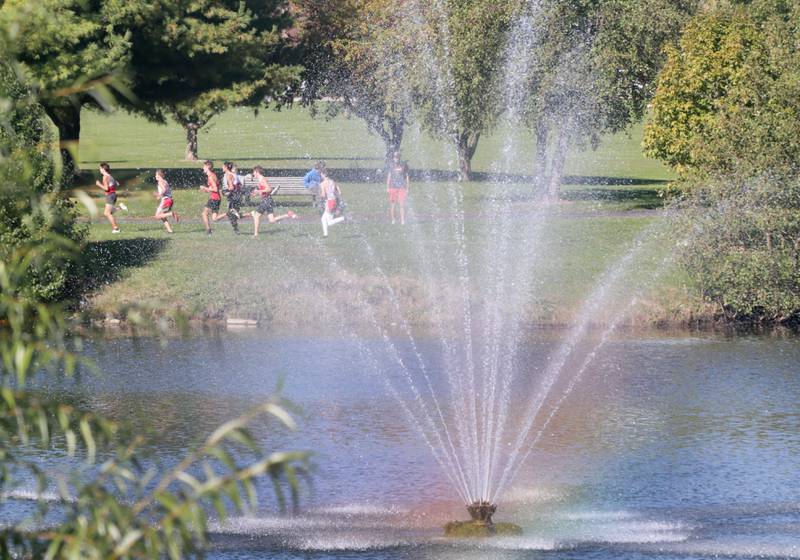 Runners make their way to the half way point during the Class 2A Regional cross country meet at Baker Lake in Peru on Saturday Oct. 23, 2021.