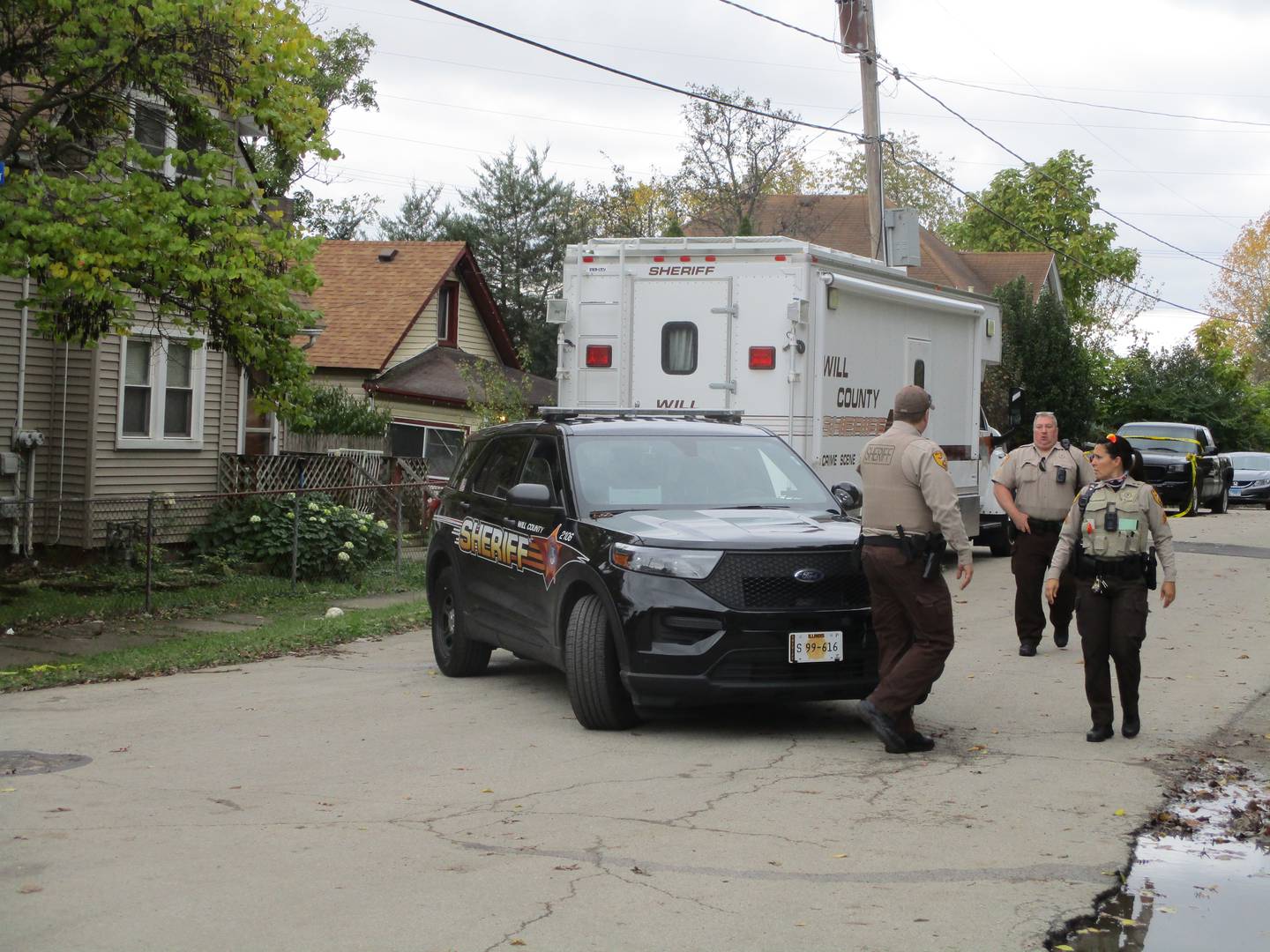 Will County Sheriff deputies on Sunday, Oct. 31, 2021 block off the crime scene from a shooting that killed two and wounded 10 others at about 12:39 a.m. during a Halloween party at a house at 1018 E. Jackson St. in Joliet Township.