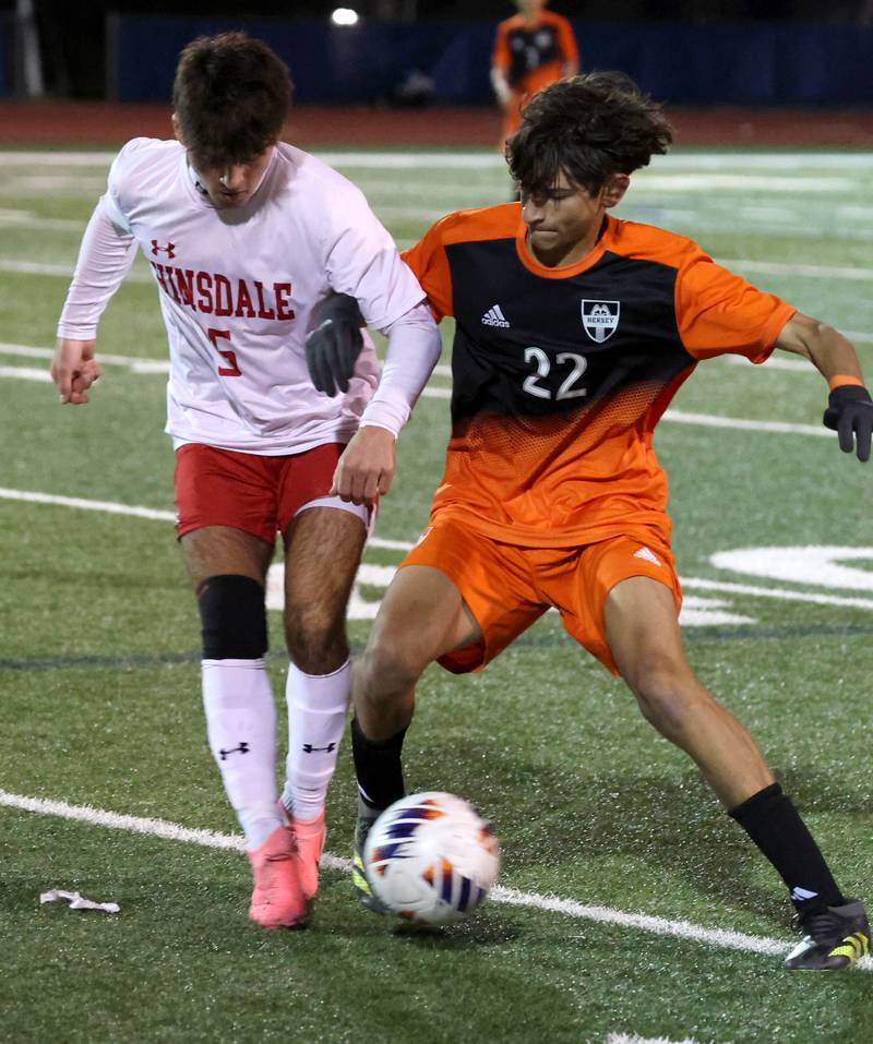 Hinsdale Central's Michael DiTomasso and Hersey's Adam Myslinski fight for possession Friday, Nov. 8, 2024, during their Class 3A state semifinal game at Hoffman Estates High School.