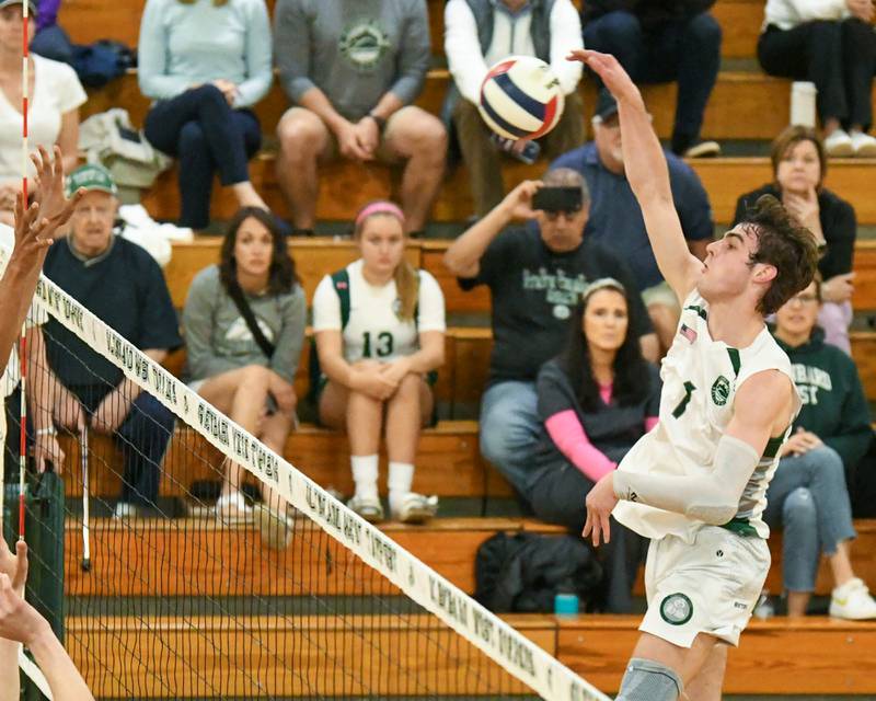 Glenbard West's Casey Maas (1) spikes the ball during the game while taking on Oak Park-River Forest on Tuesday April 16, 2024, held at Glenbard West High School.