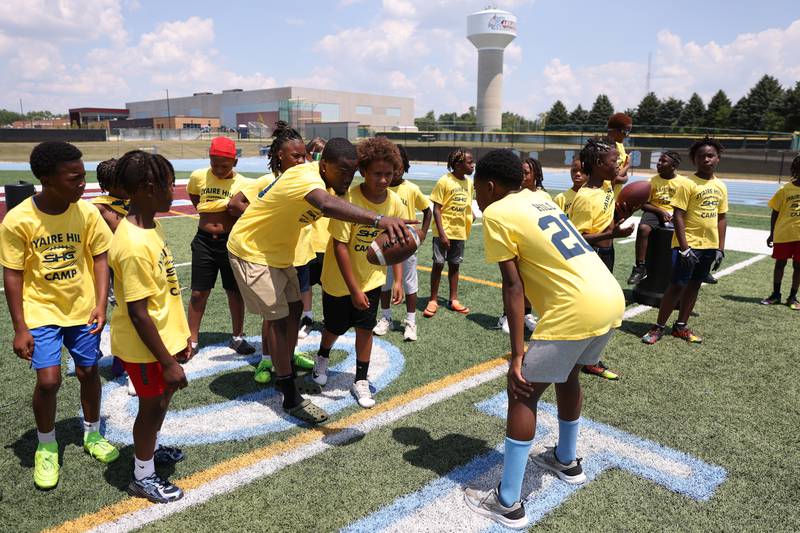 Kankakee High School graduate Davi Jones instructs campers during the second annual Suga Summer Camp at Kankakee High School on Saturday, July 5, 2025.