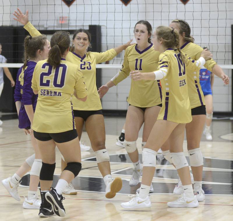 The Serena Huskers celebrate set point early in their match at Woodland on Tuesday, Sept. 5, 2023.