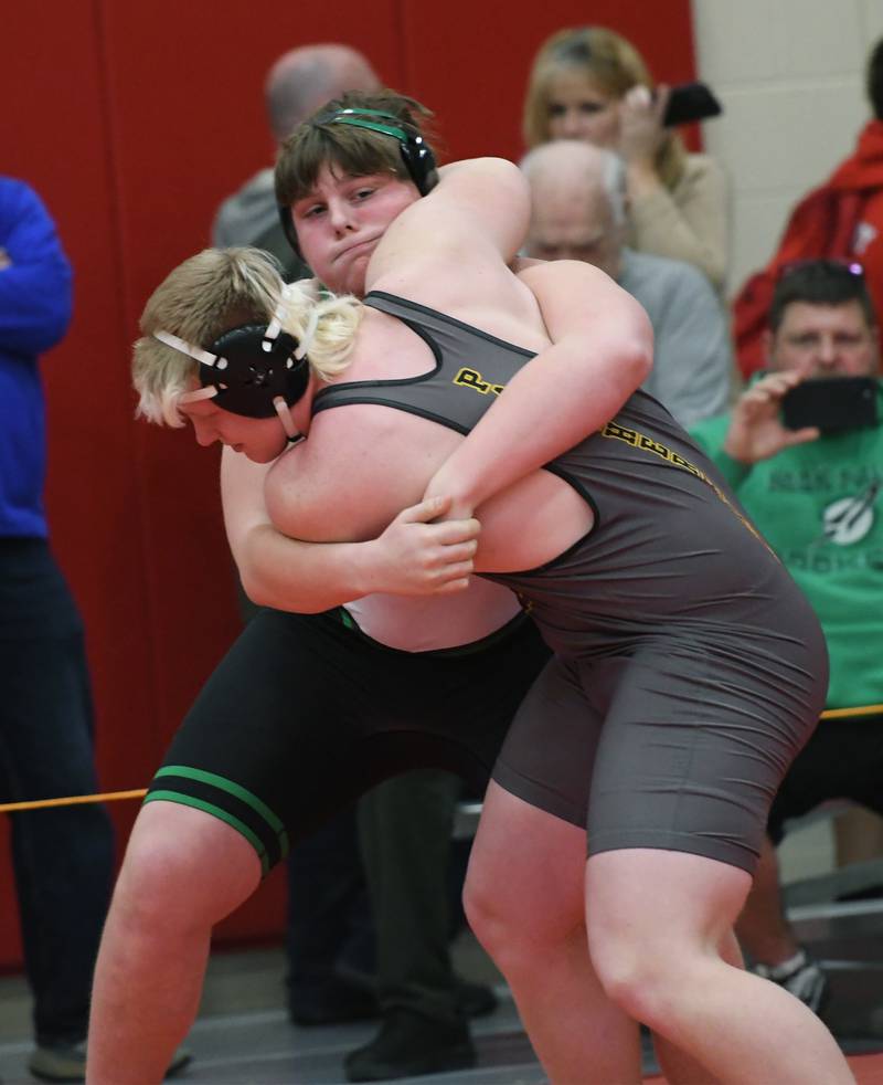 Rock Falls' Jacob Hosler wraps up Lena-Winslow's Henry Engel at the start of their 285-pound match at the 1A Oregon Wrestling Sectional on Friday night.