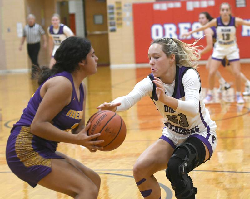 Dixon's Hannah Steinmeyer gets a hand on the ball as the Duchesses press against Mendota at the Oregon Tip Off Tournament on Wednesday. Nov. 26.