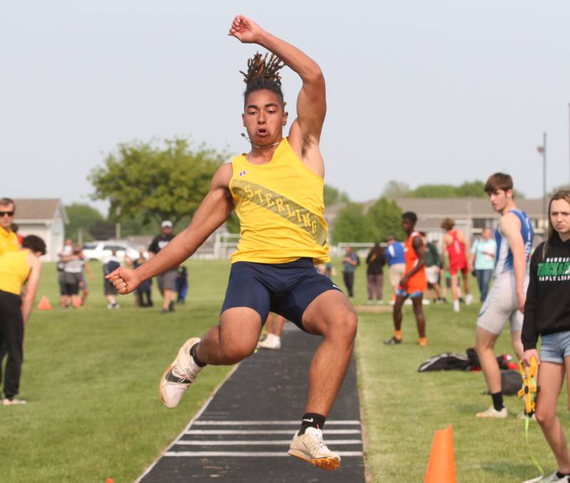 Sterling's Justin Benson competes in the long jump during the Class 2A track sectional meet on Wednesday, May 17, 2023 at Geneseo High School.