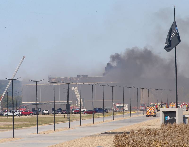 Smoke billows from Marquis Energy as firefighters work to control a structure fire on Wednesday, Oct. 8, 2025 in Hennepin. The fire was upgraded to a 5th alarm dispatching the (MABAS) Mutual Aid Box Alarm System. The fire broke out around 11a.m.