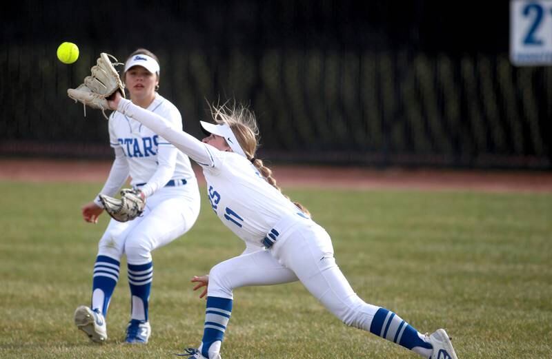 St. Charles North's Ivy Gleeson reaches for a catch during a game against Wheaton North on Tuesday, April 15, 2025 in St. Charles.