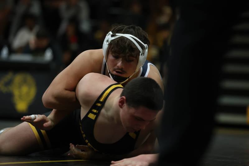 Plainfield South’s Chase Pierceall works over Joliet West’s James Koulis in the 190 pound match on Wednesday, Dec. 3, 2025 in Joliet.