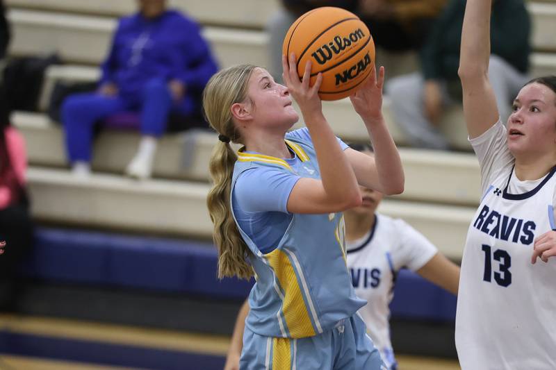 Joliet Catholic’s Emma Napier takes a shot against Reavis in the Peotone Blue Devils Holiday Classic championship game on Monday, Dec. 29, 2025 in Peotone.