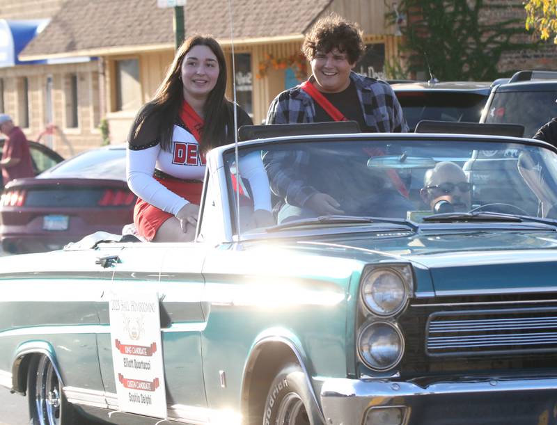 Hall king and queen candidates Sophia Delphi and Elliott Quartucci ride in the Hall High School Homecoming parade on Thursday, Sept. 28, 2023 in Spring Valley.