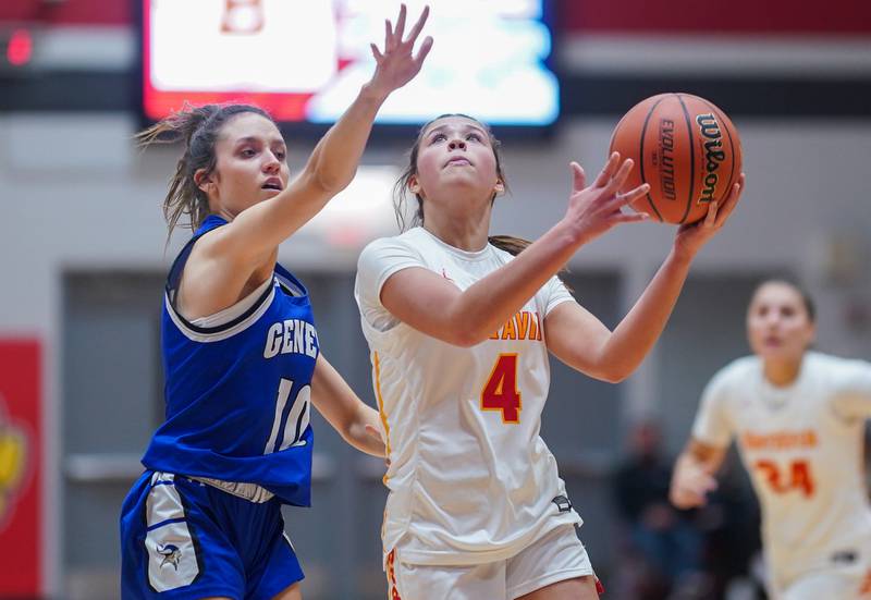 Batavia's Addi Lowe (4) shoots the ball in the post against Geneva’s Peri Sweeney (10) during a basketball game at Batavia High School on Friday, Jan 26, 2024.
