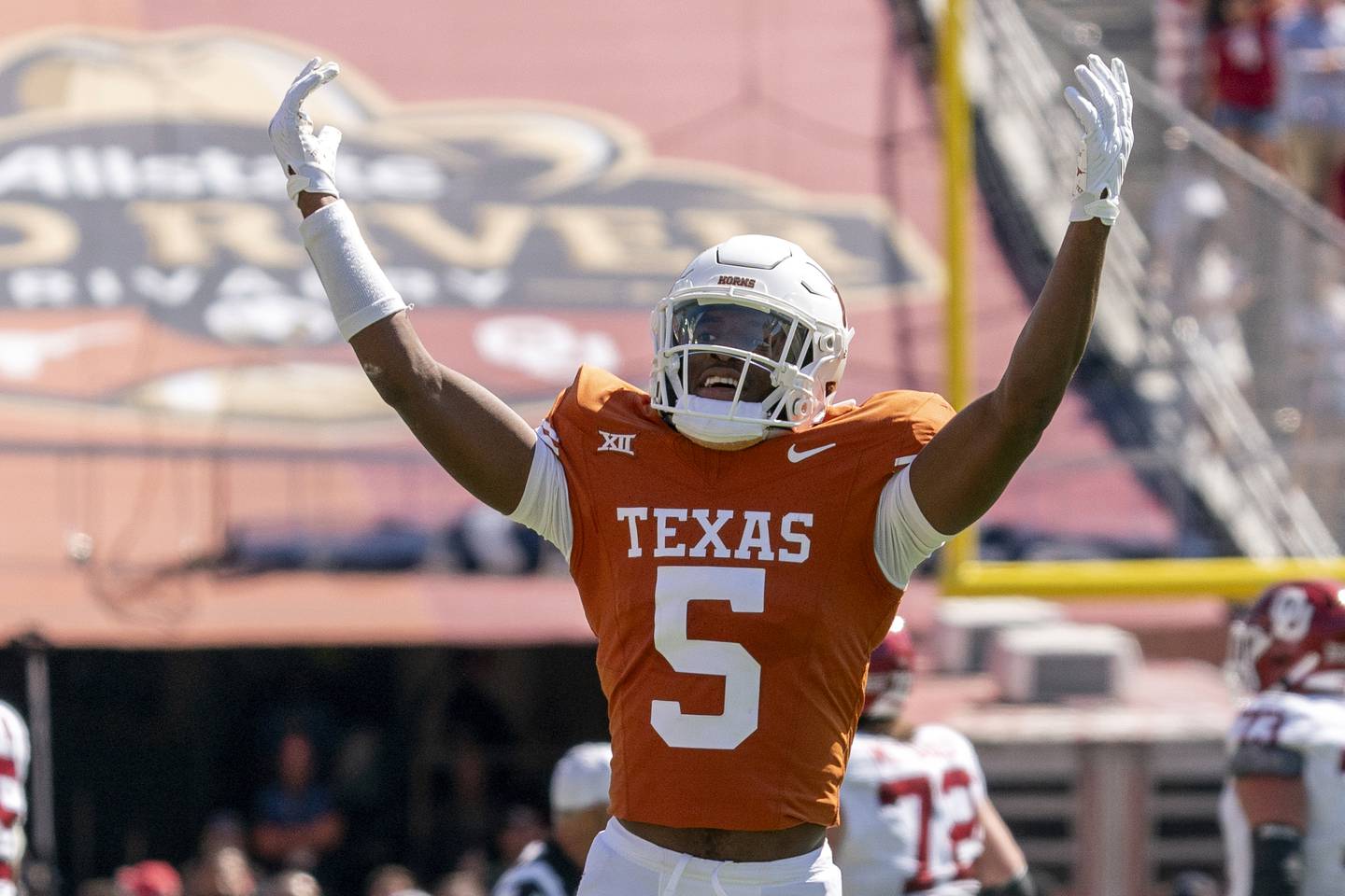Texas defensive back Malik Muhammad (5) gestures to the crowd during an NCAA college football game against Oklahoma at the Cotton Bowl, Saturday, Oct. 7, 2023, in Dallas. Oklahoma won 34-30. (AP Photo/Jeffrey McWhorter)