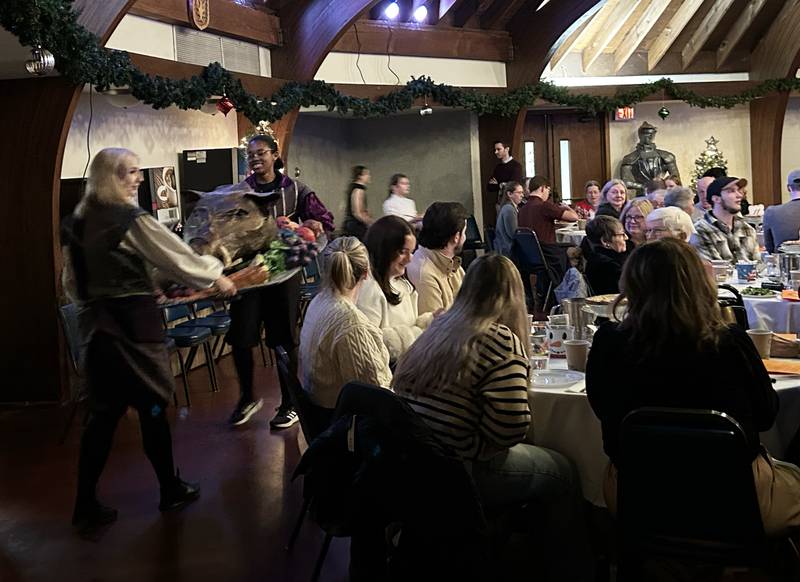 The "roast beast" is carried into the dining hall during Oregon High School's Madrigal Dinner on Saturday, Dec. 7, 2024 at the Brubaker Center. The dinners were held at Stronghold Camp & Retreat Center north of Oregon. The troupe also performed on Friday. Dec. 6.
