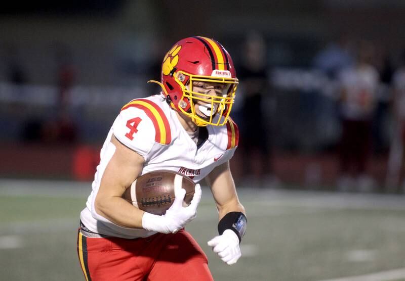 Batavia’s Charlie Whelpley carries the ball during a game at St. Charles North on Friday, Sept. 15, 2023.