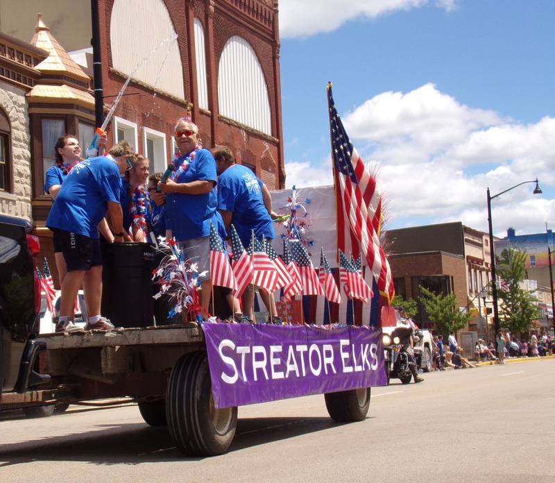 The Streator Elks Club squirts water guns at parade spectators Sunday, June 30, 2024, during the Liberty Fest parade in Streator.