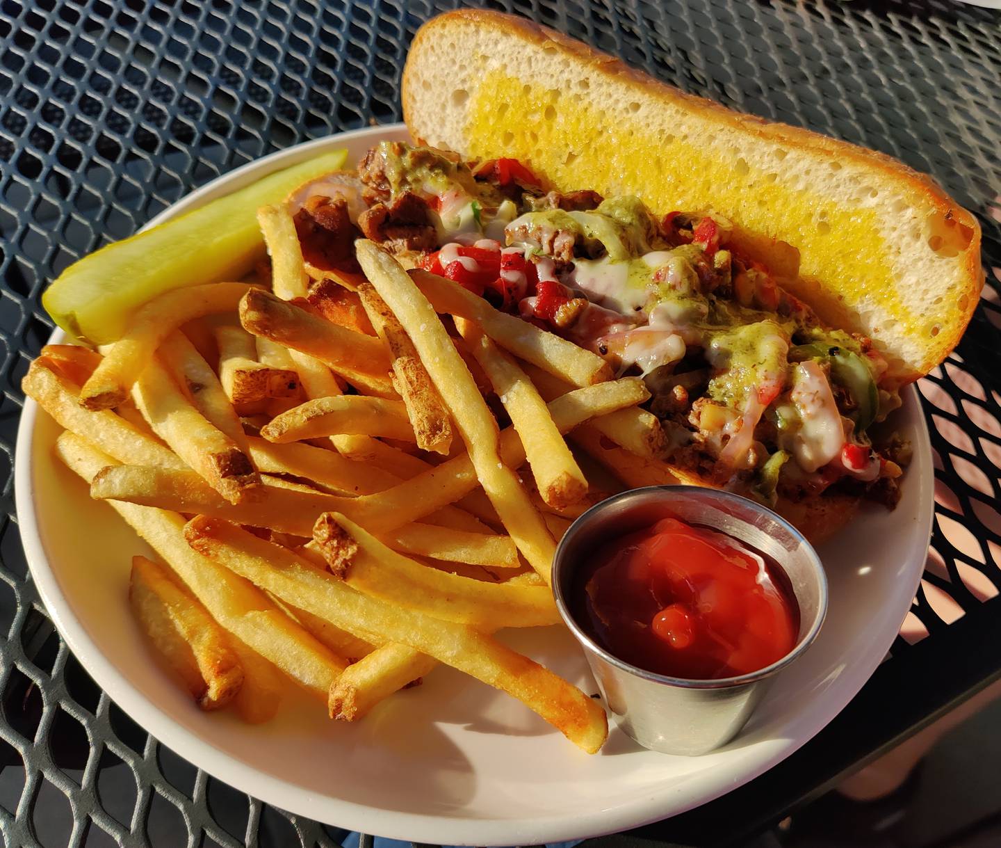 The steak melt handheld at Alter Brewing + Kitchen in St. Charles.