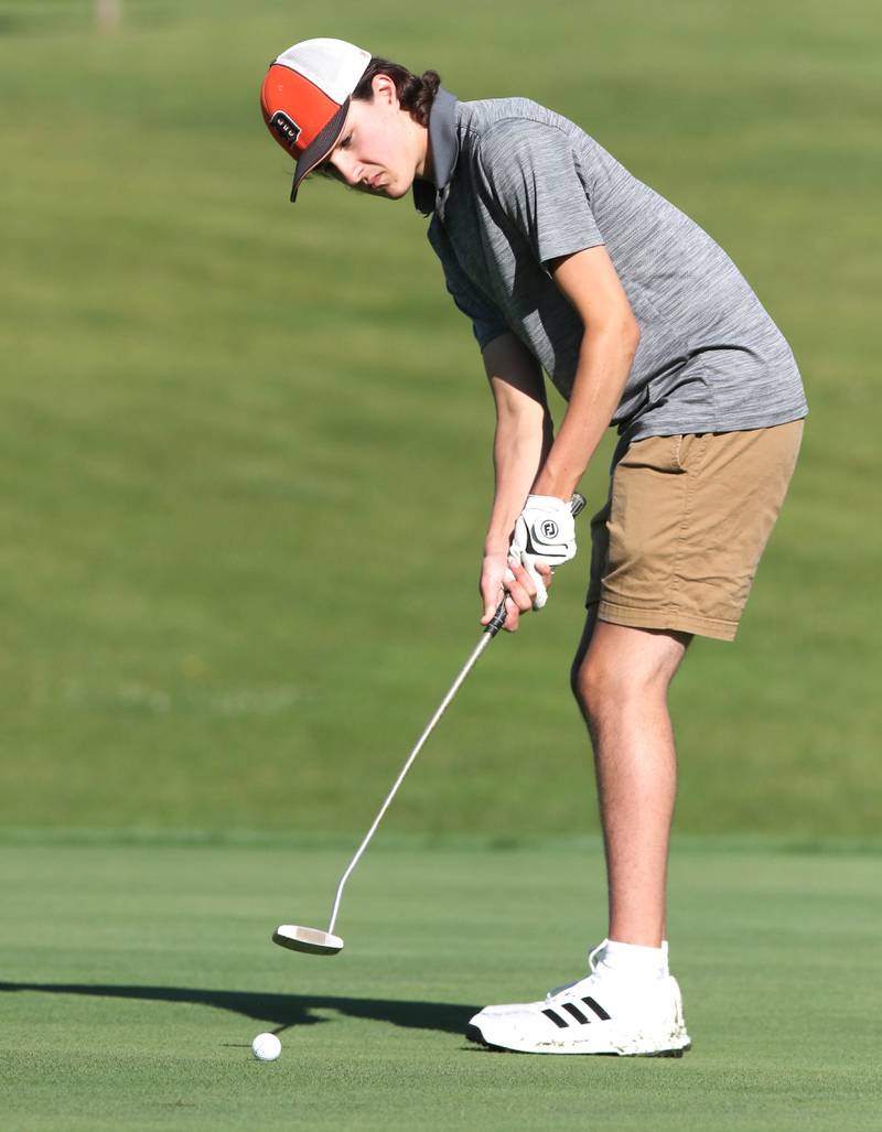 DeKalb's TJ Fontana sinks a putt on the 4th hole Tuesday, Aug. 9, 2022, during golf practice at River Heights Golf Course in DeKalb.