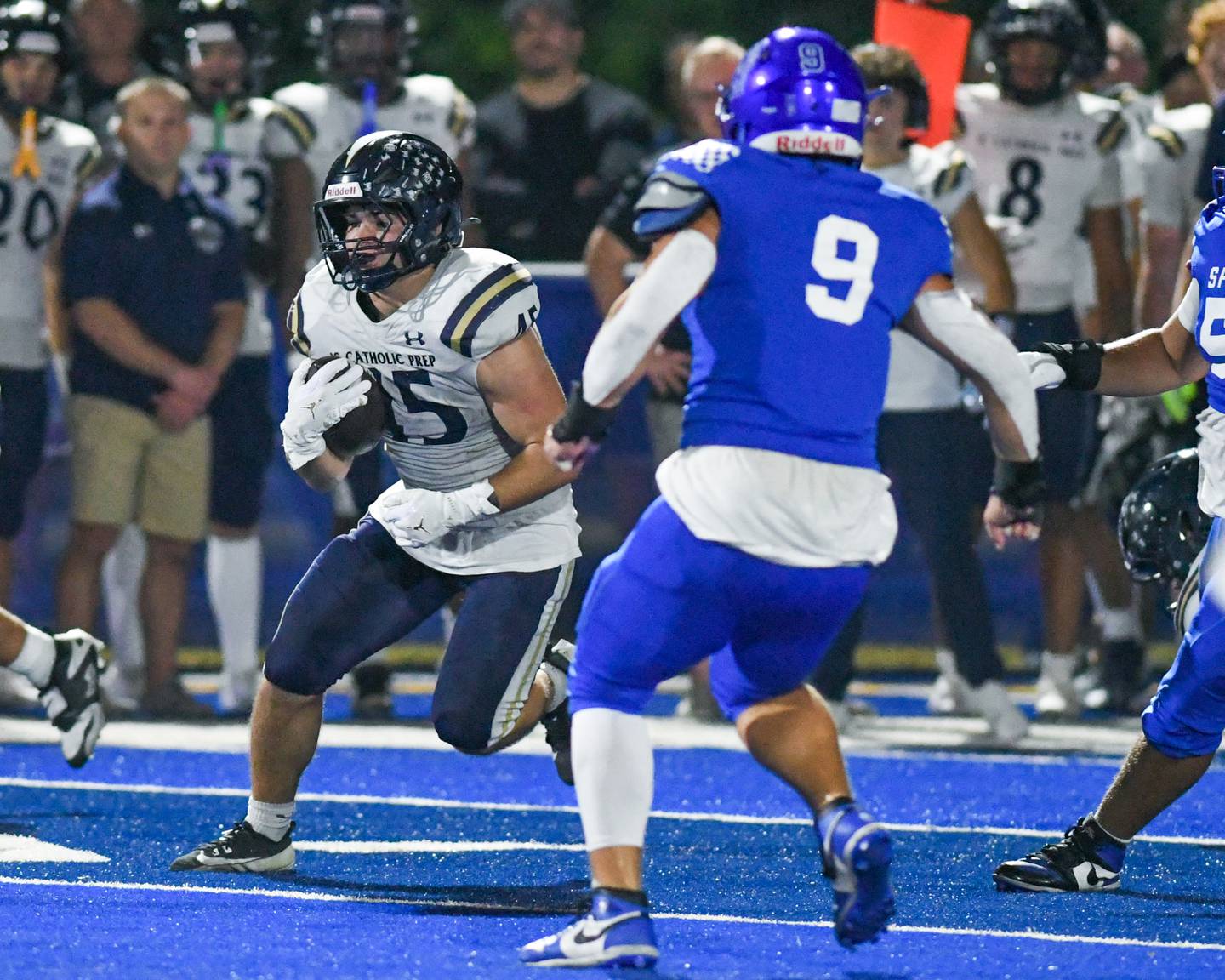 IC Catholic Prep's Foley Calcagno (45) runs the ball before being tackled by St. Francis defenders on Friday Oct. 3, 2025, held at St. Francis High School.