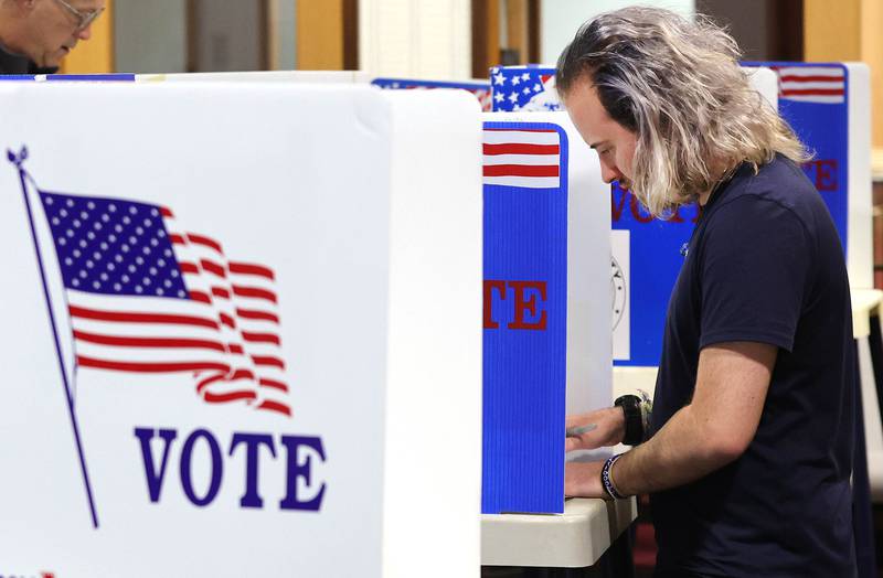 Northern Illinois University senior Dallas Douglass, from DeKalb, fills out his ballot Tuesday, June 28, 2022, at the polling place in Westminster Presbyterian Church in DeKalb.