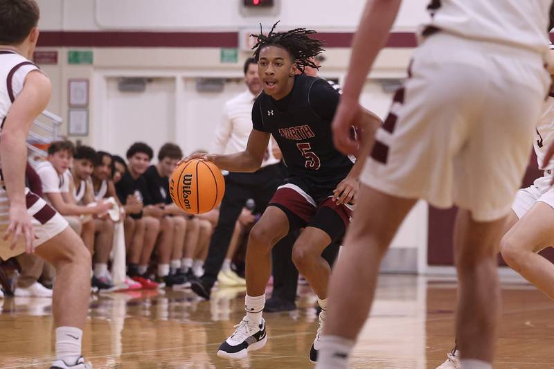 Plainfield North’s Darin Ashiru works the ball against Lockport on Friday, Jan. 3, 2025 in Lockport