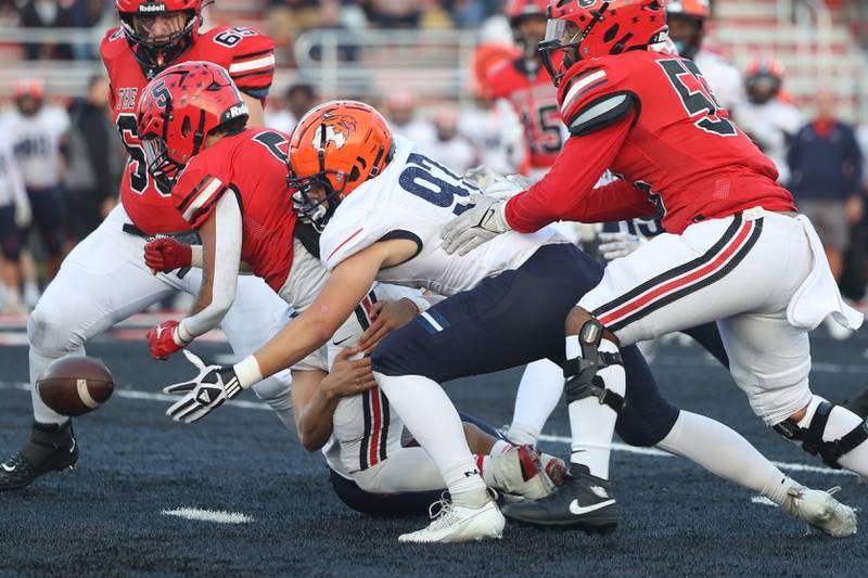 Naperville North’s Ben Allen get the forced fumble recovery against Bolingbrook on Friday, Sept. 8, 2023 in Bolingbrook.
