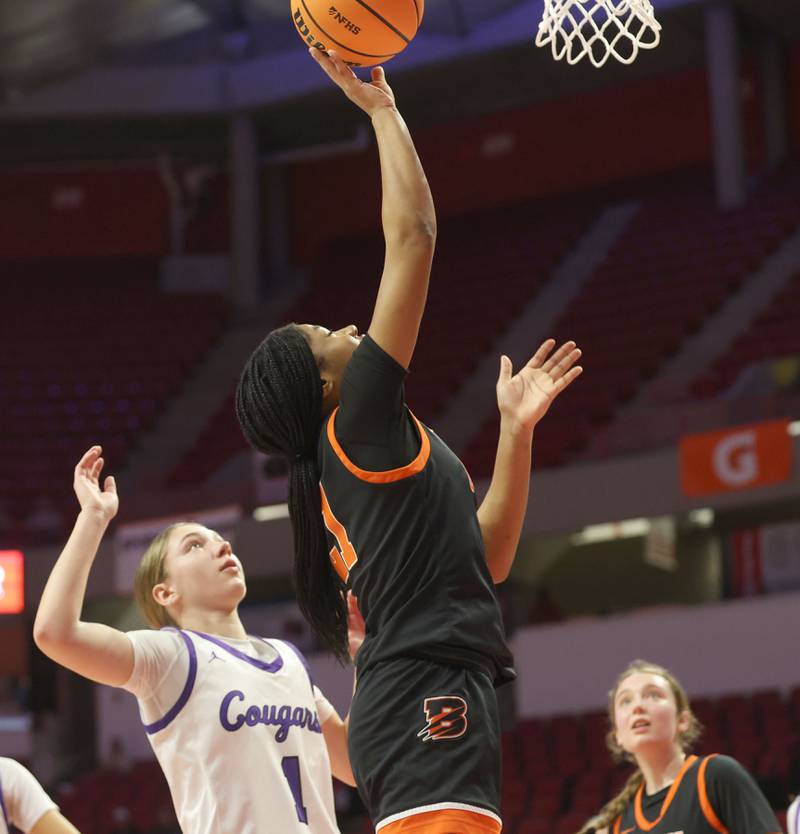 Byron's Milia Morton sneaks inside the lane to score against Breese Centra's Ella Nettemeier during the Class 2A title game on Saturday, March 7, 2026 at CEFCU Arena in Normal.
