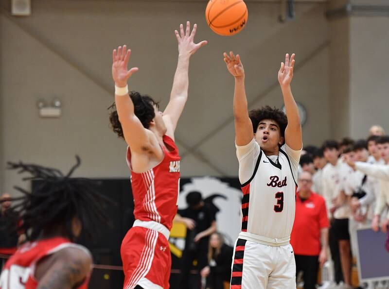 Benet’s Jayden Wright (3) shoots one of his three pointers during a game against Marist on Friday, Dec. 13, 2024 at Benet Academy in Lisle.