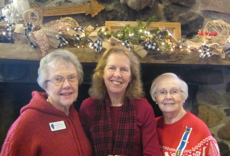 Regent Diana Williamson (left) and Chaplain Florence Finfeld congratulate Paula Briggs (center), of Sparland, following her new member welcoming ceremony Dec. 1 at the NSDAR Chief Senachwine Chapter meeting at the Lake Thunderbird Clubhouse.