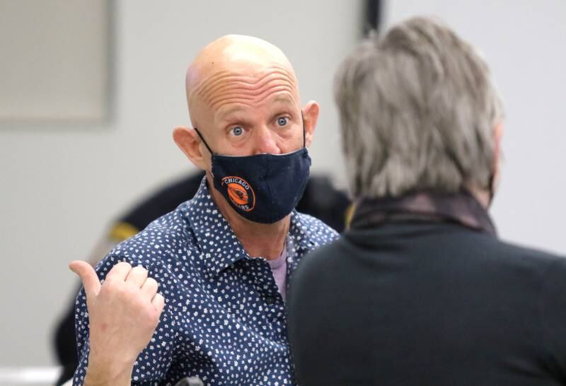 DeKalb Citizens Police Review Board members   Justin Carlson and Kate Noreiko, former fifth ward alderman, talk before the start of the first meeting of the board Thursday, Feb. 3, 2022, at the DeKalb Police Department.
