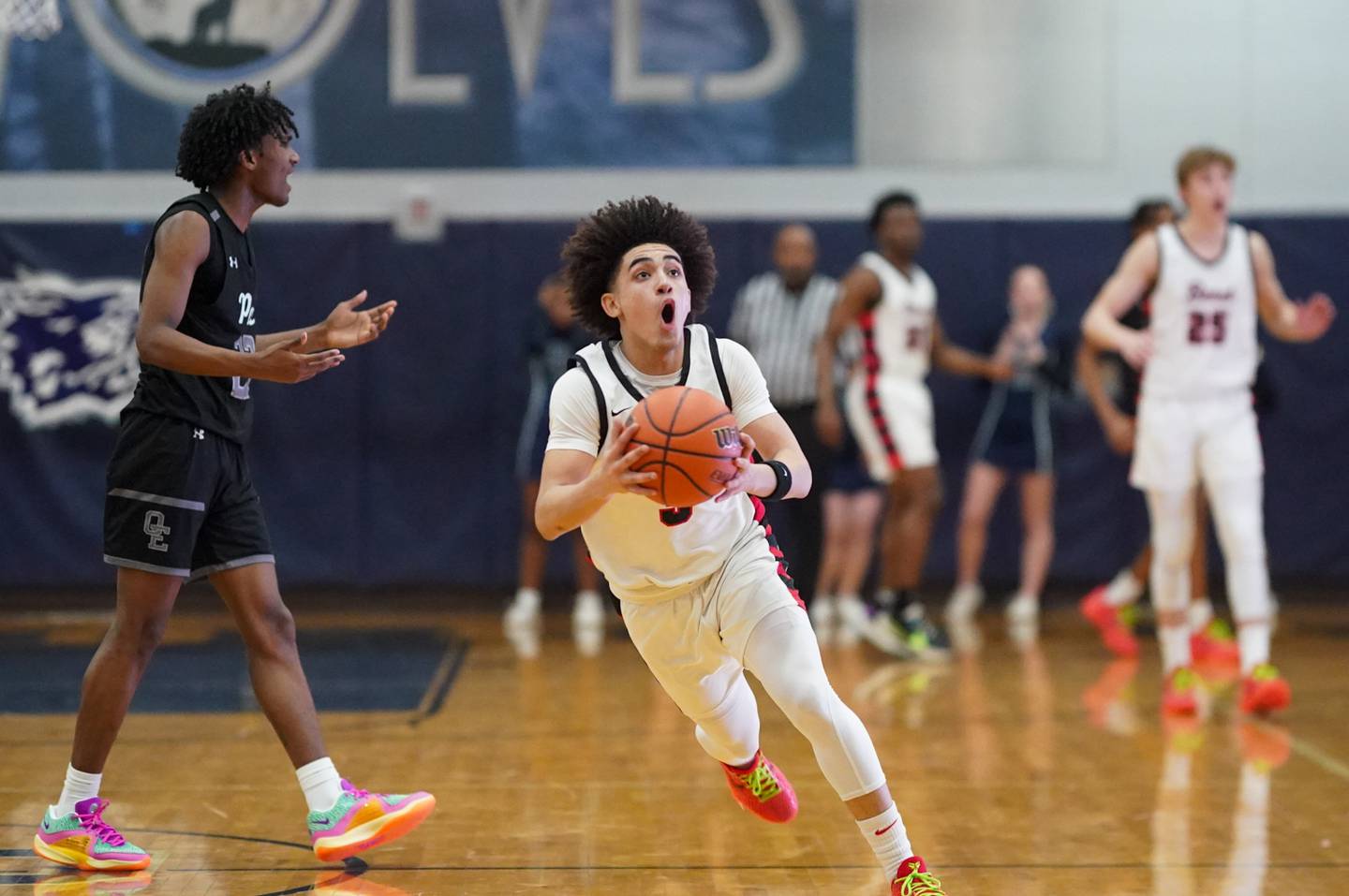 Benet’s Jayden Wright (3) reacts after being called for a foul against Oswego East's Jehvion Starwood (22) during a Class 4A Oswego East regional final basketball game at Oswego East High School on Friday, Feb 23, 2024.