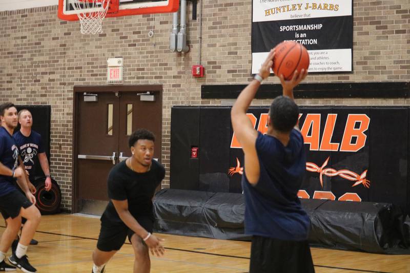 Ray Hernandez (right) shoots his shot Monday, Dec. 5, 2022 in the Toys for Tots community basketball game.