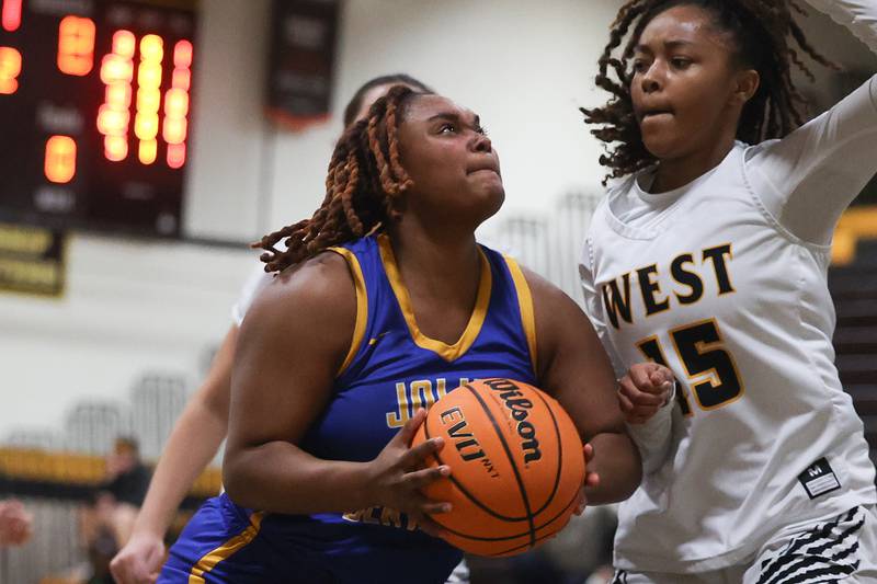 Joliet Central’s Alexis Pedrosa battle for the basket against Joliet West on Thursday, Jan 30, 2025 in Joliet.