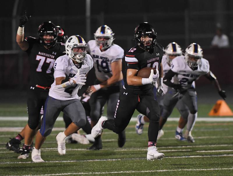 Barrington’s Dillon Fitzpatrick runs for his second touchdown in the first quarter against Warren at Barrington High School Friday, August 25, 2023.