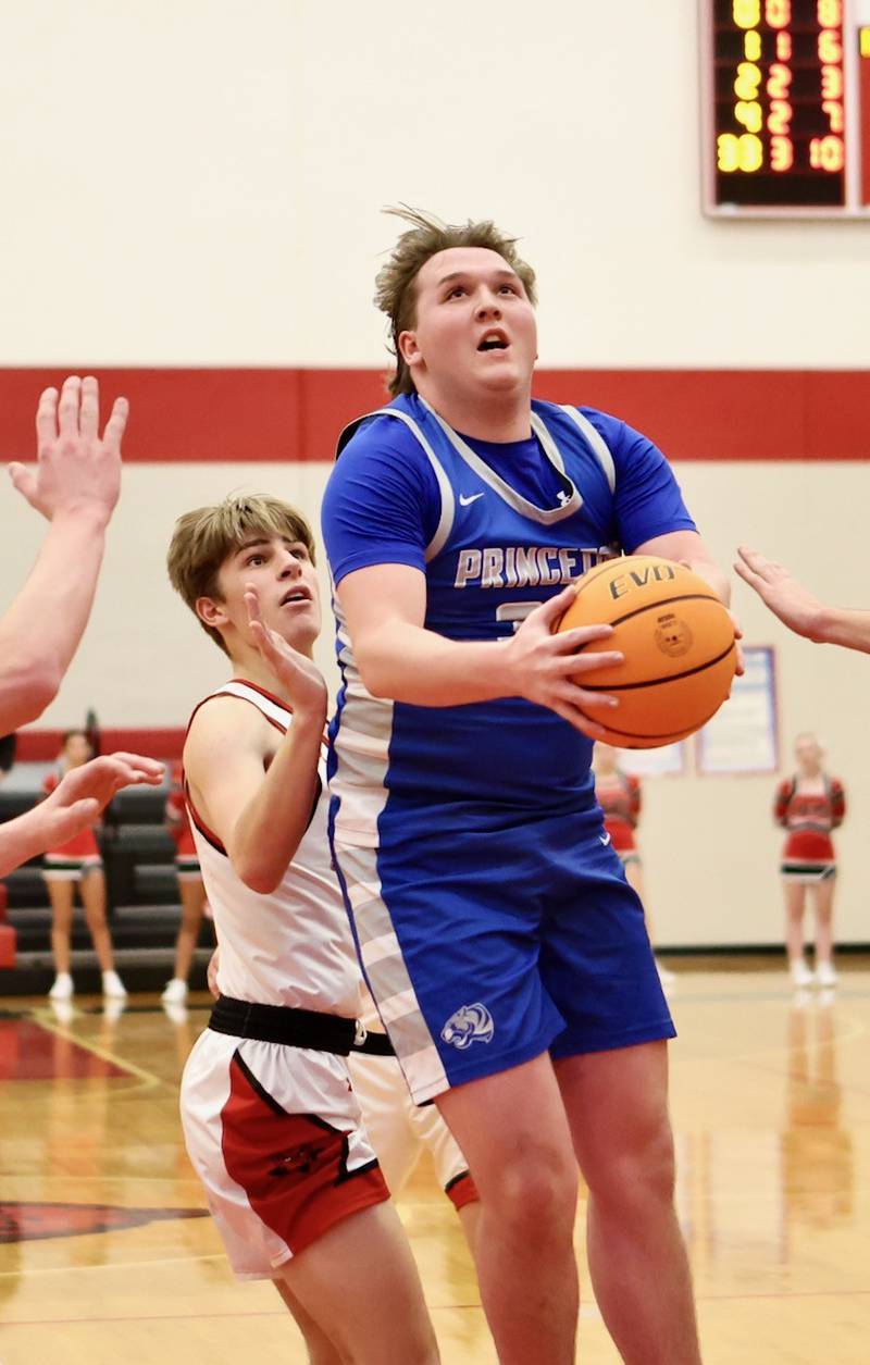 Princeton's Jordan Reinhardt drives against Hall at the Colmone Classic on Friday night.