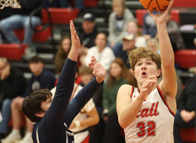 Hall's Chace Sterling gets a shot off around Fieldcrest's Kayden Eilts during the Colmone Classic on Friday, Dec. 12, 2025 at Hall High School.