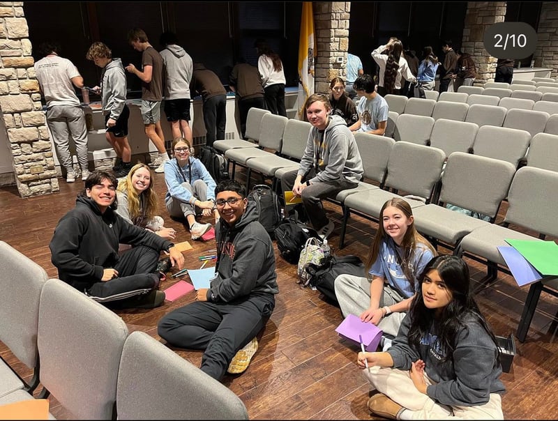 Joliet Catholic Academy students (from left) Andy Munoz, Jackie Stary, Claire Blotnik, Darian Arteaga, Nathan Novak, Lyndsay Black and Alondra Espino make holiday cards during  the JCA Key Club's first Keymas program, which took placed over 12 days in December 2022.